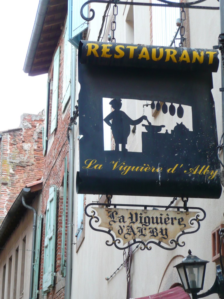 Der wohlbeleibte Koch an seinem Herd